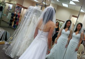 A woman with adrenal insufficiency does not have the strength to smile even though he should be happy while she tries on her wedding dress.